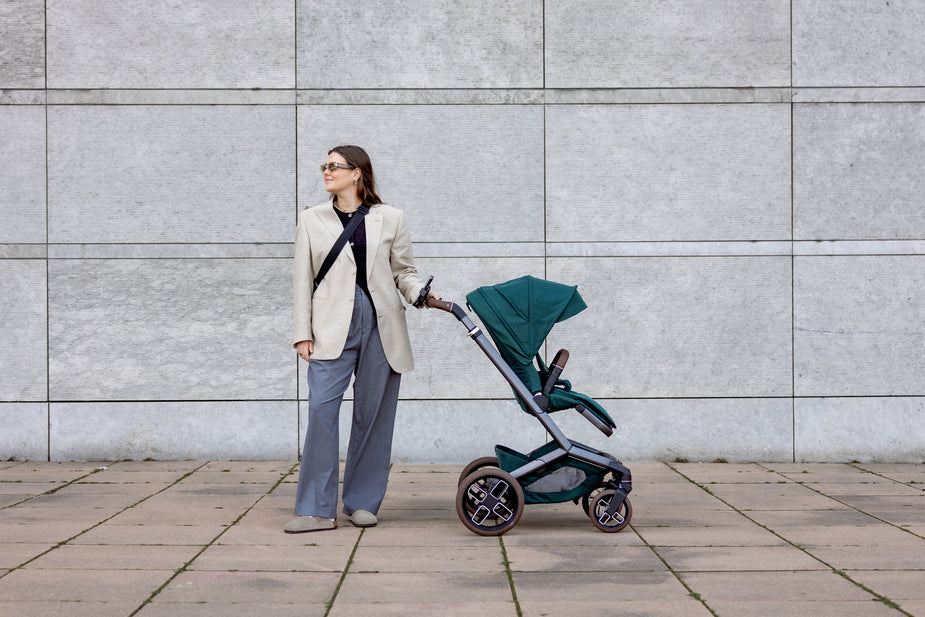 Toddler smiling in stroller