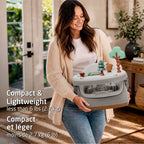 Lifestyle shot emphasizing the compact, lightweight design of the booster seat, being easily carried for travel or storage.