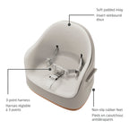 Detailed view of the soft padded seat inlay, the secure adjustable 3-point harness, and the stable non-slip rubber feet.