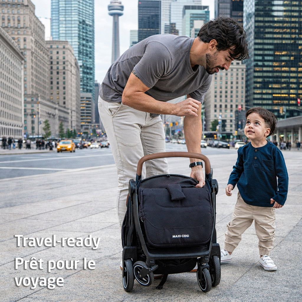 A stylish dad with the ultra-light folded Maxi-Cosi stroller and his toddler in a busy city.