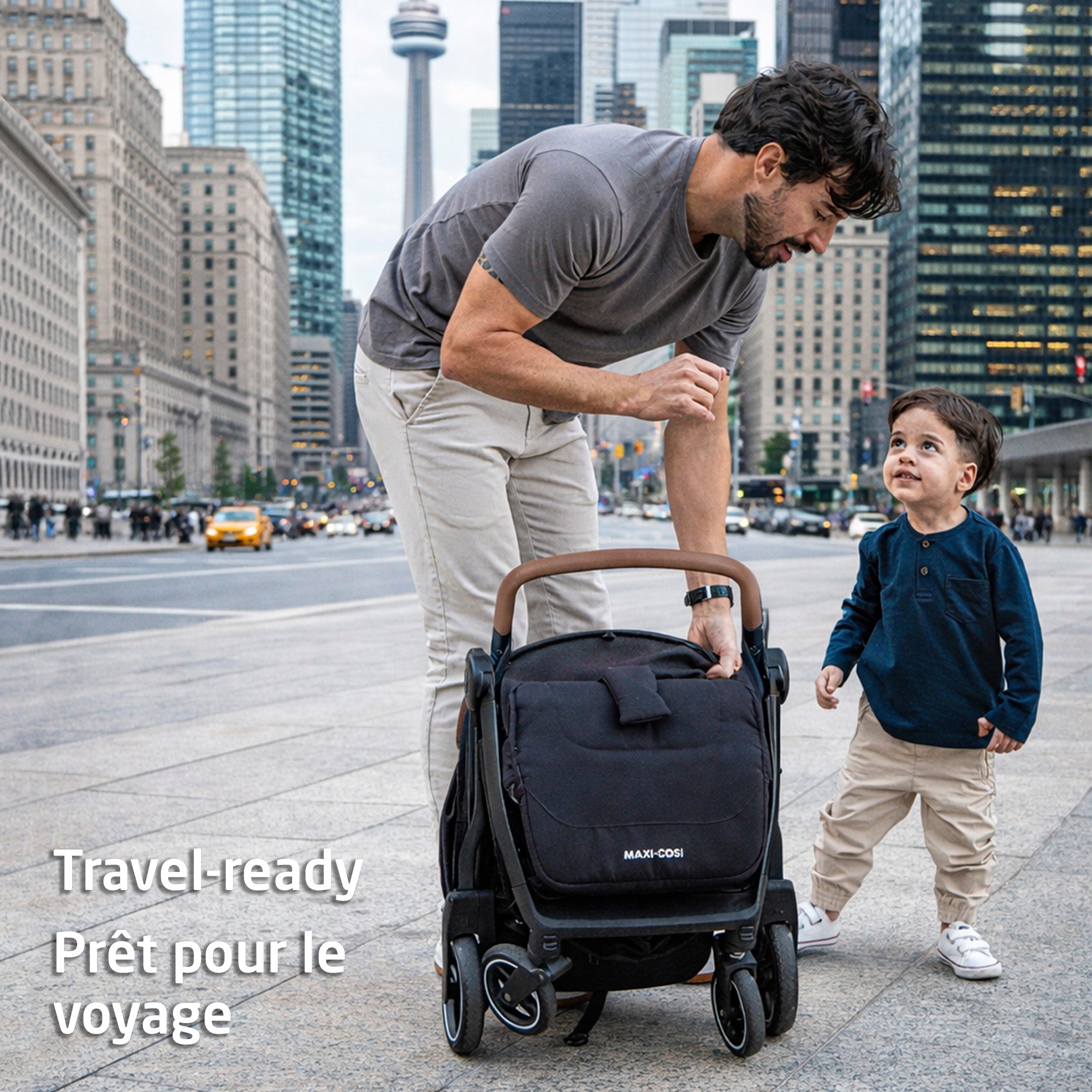 A stylish dad with the ultra-light folded Maxi-Cosi stroller and his toddler in a busy city.
