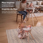 Maxi-Cosi Moa baby doll high chair styled alongside the real-life full-size Moa high chair with parent and baby.